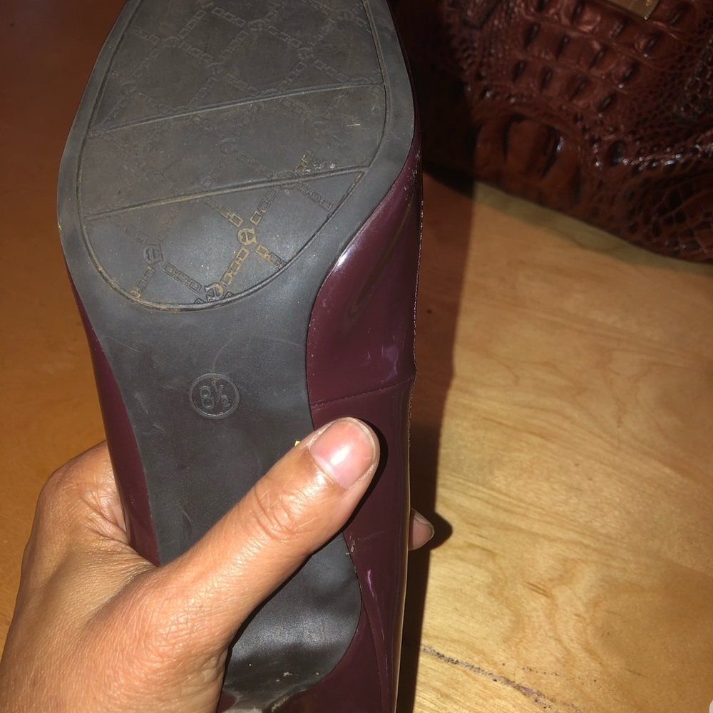 Maroon and black spectator Aigner heels.